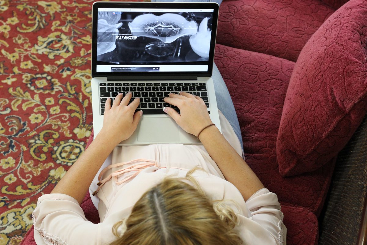 Bidder browsing Amos McCoy Auctioneer online auction on HiBid from home